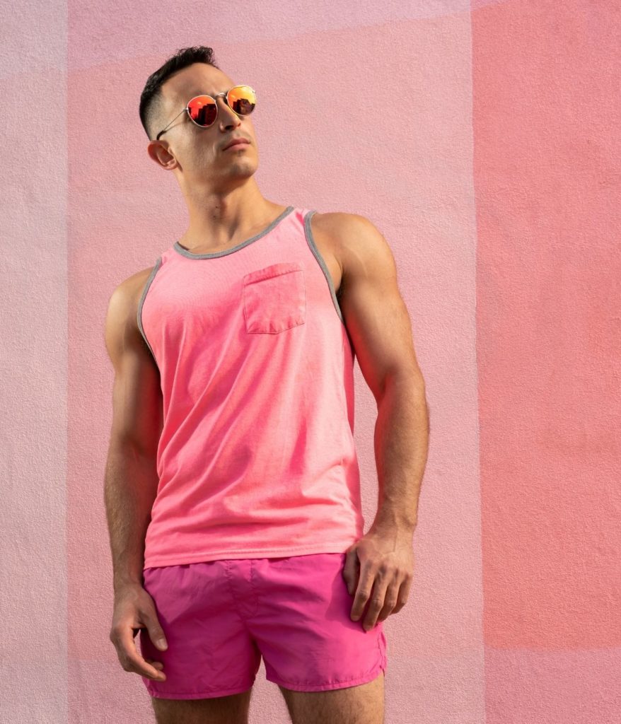 Male model posing for North Park photoshoot in all pink.